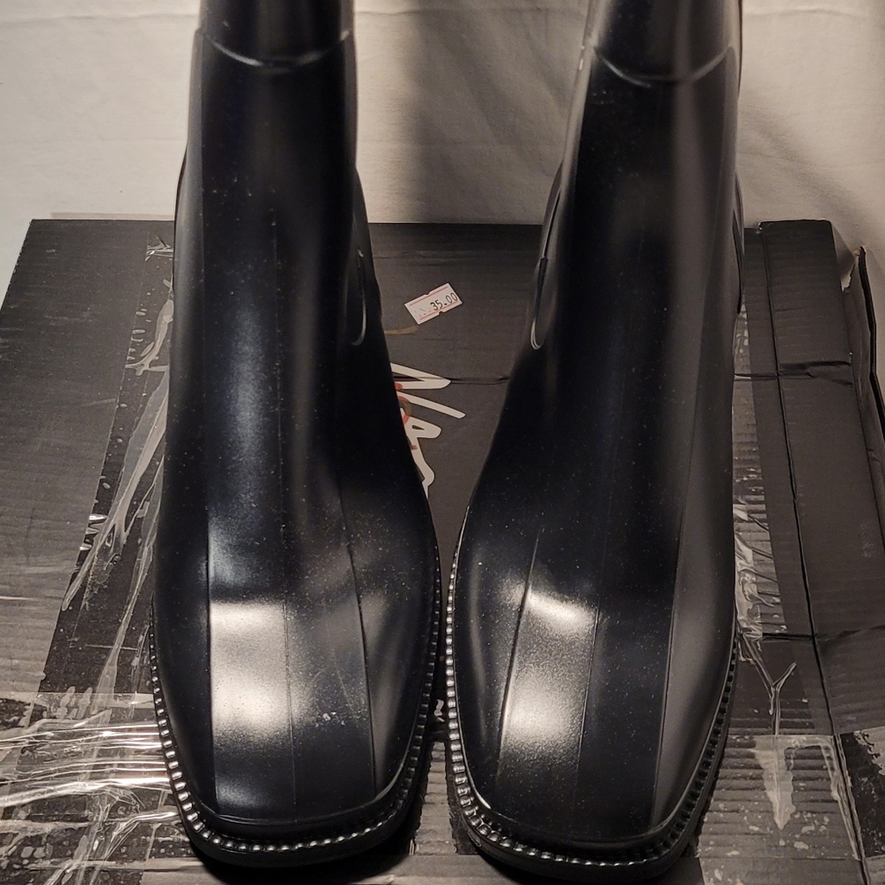 Nasty gal. Black pull on raincoats size 7